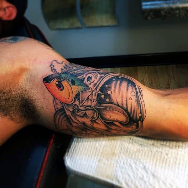 Black And White Bass Fish Tattoo With Color Added On Mans Inner Bicep