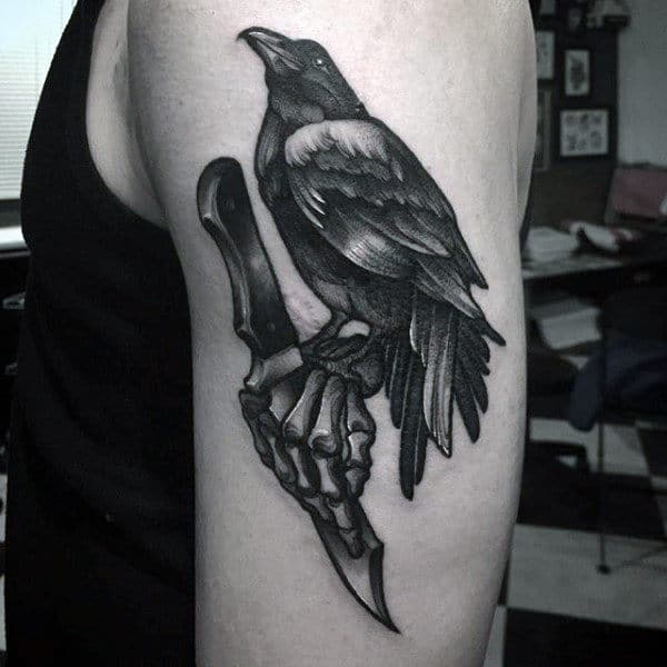 Black Crow Dagger And Skeleton Hand Mens Upper Arm Tattoo