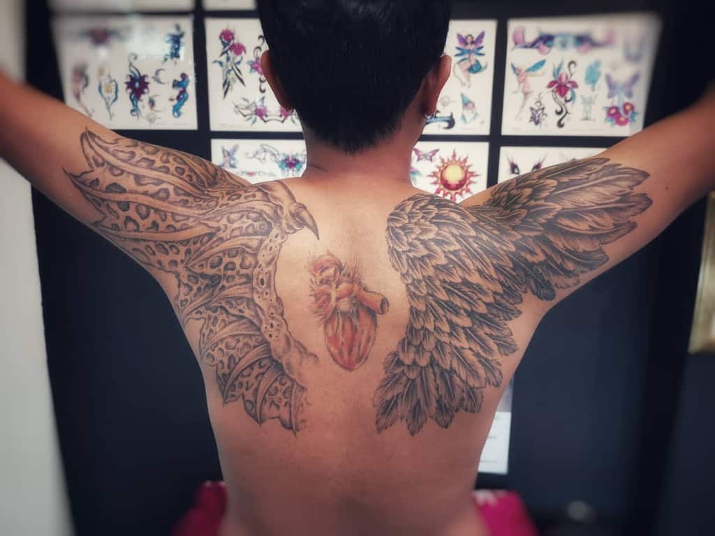 a devil with angel wing tattoos | Louis | Flickr