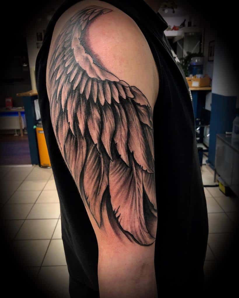 black-grey-inked-realism-angel-wing-tattoo-nedelincvetanov