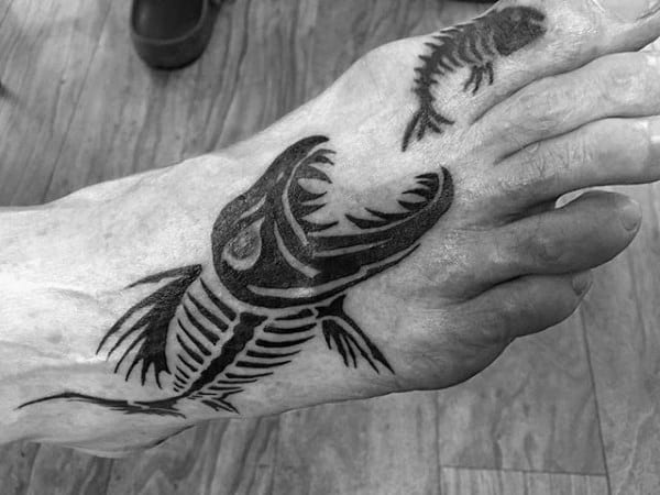 Black Ink Fish Eating Fish Skeleton Mens Foot Tattoos