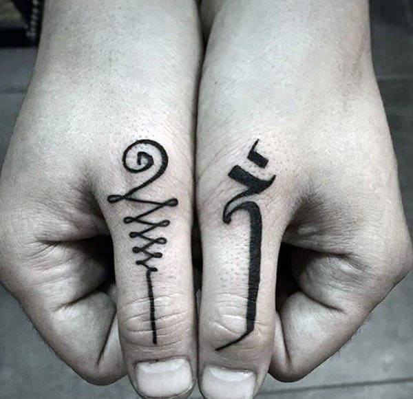 Black Ink Guys Thumb Tatto Design Inspiration