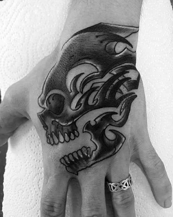 Black Ink Hand Male Tribal Skull Tattoo Designs