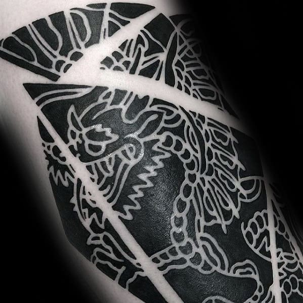 black-ink-negative-space-guys-small-dragon-arm-tattoo
