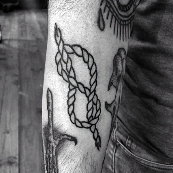 Black Ink Outline Knot Tattoo On Male