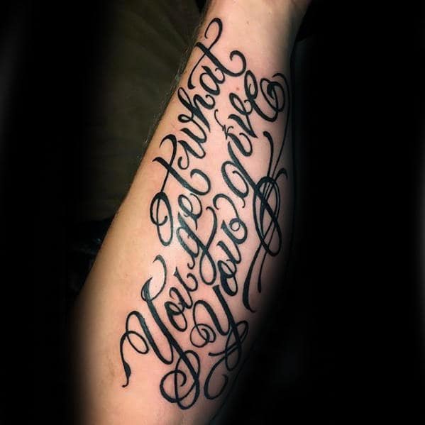 Awesome Black Ink Quote Tattoo On Left Forearm