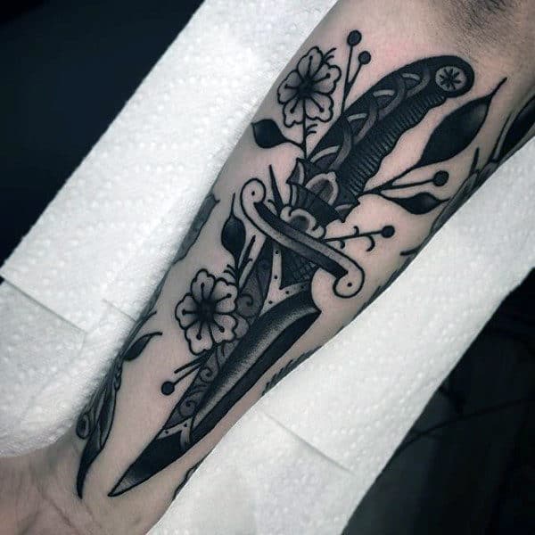 Black Ink Shaded Floral Traditional Dagger Mens Outer Forearm Tattoo Inspiration