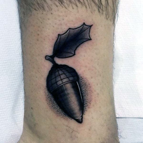Black Ink Shaded Small Simple Guys Acorn Tattoo On Lower Leg