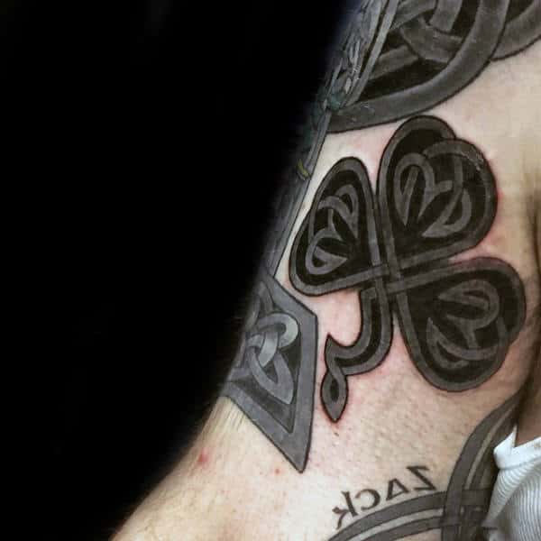 Black Ink Shamrock Celtic Male Tattoo On Arm