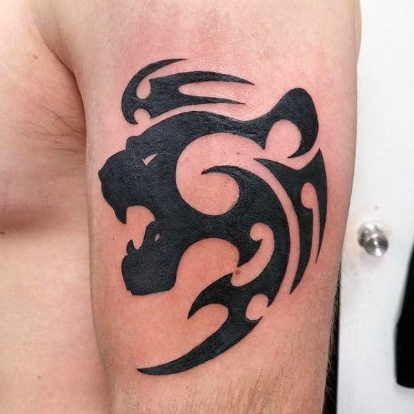 Black Ink Small Tribal Lion Outer Arm Tattoos For Men