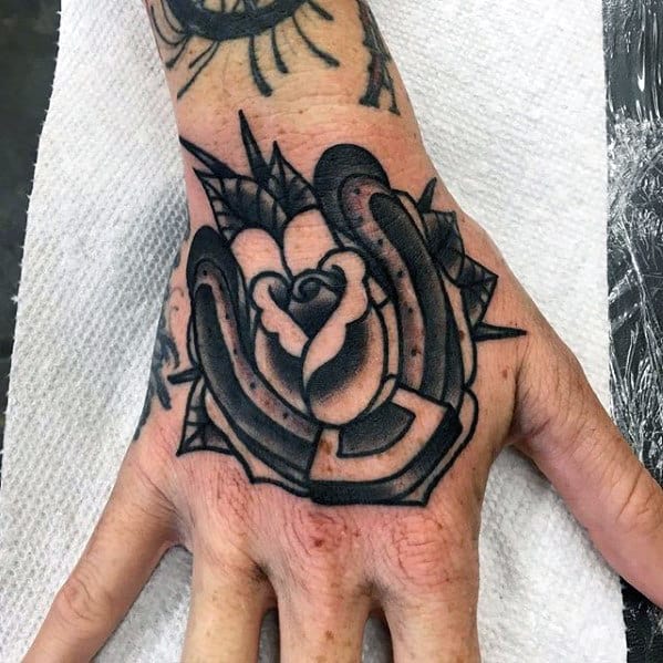 Black Ink Traditional Horseshoe Rose Flower Hand Tattoo For Men