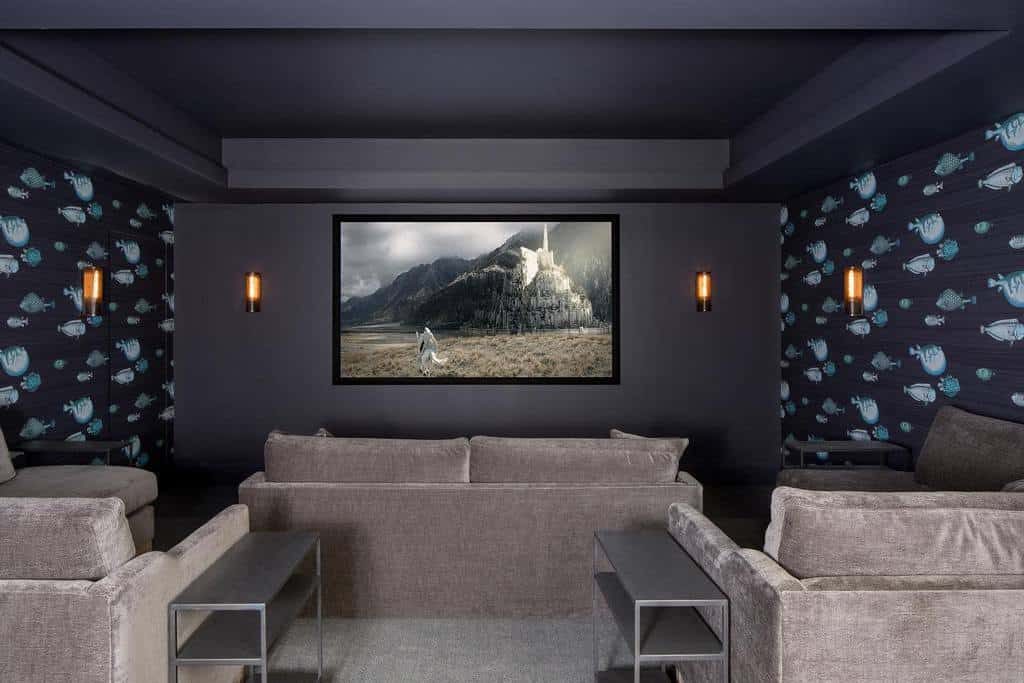 basement cinema room with gray sofas