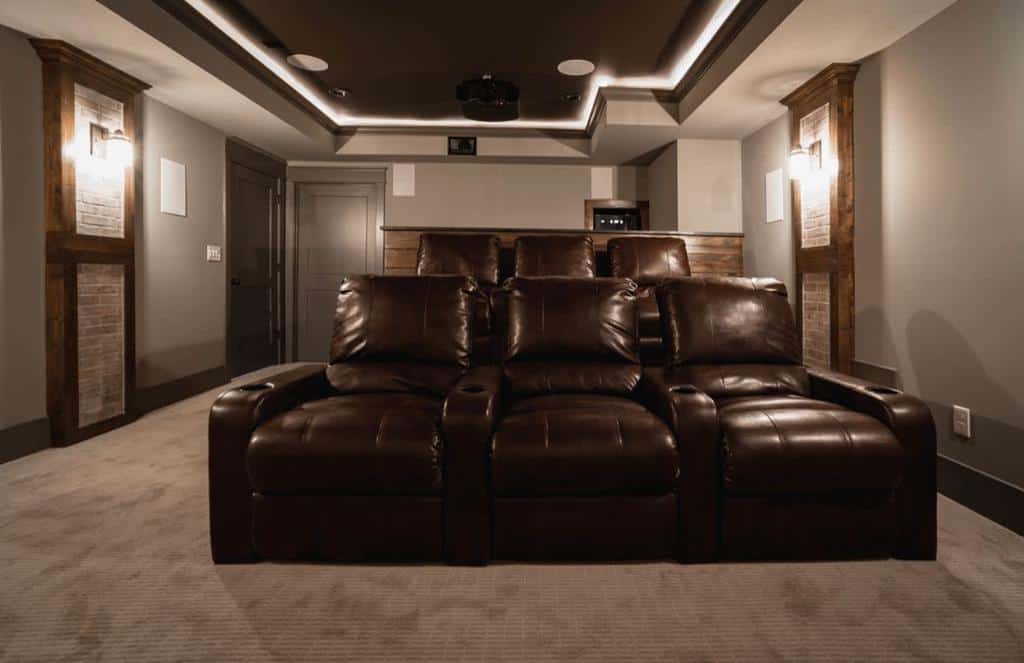 brown leather recliners in basement cinema room