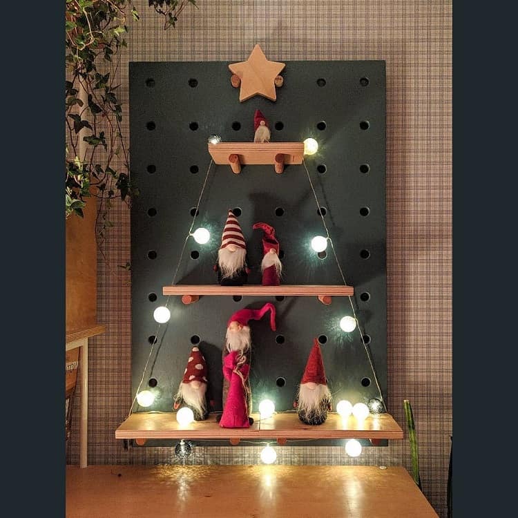 green pegboard with christmas display 