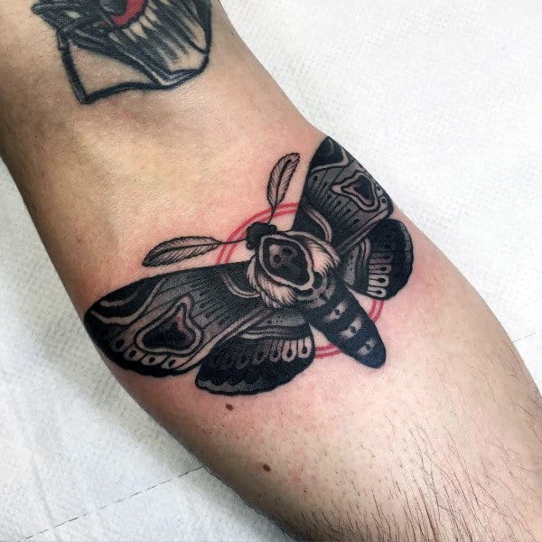 Black Moth With Red Circle Mens Inner Forearm Tattoos