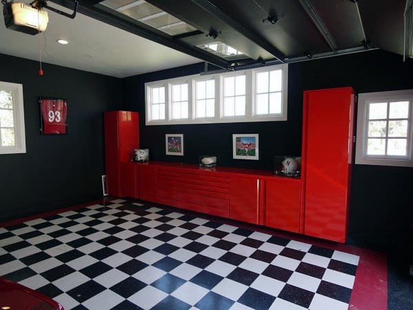 checkered floor garage with red cabinets and work bench 