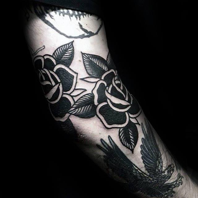 Black Roses On Mans Arm Tattoo