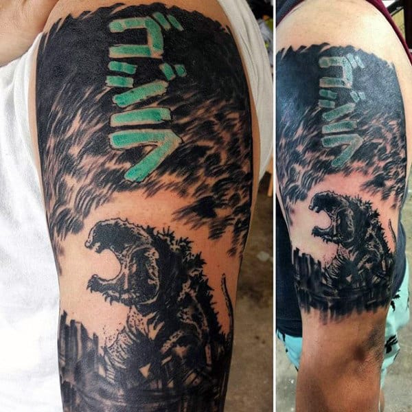 Black Tattoo With Color Godzilla Japanese Script On Mans Bicep