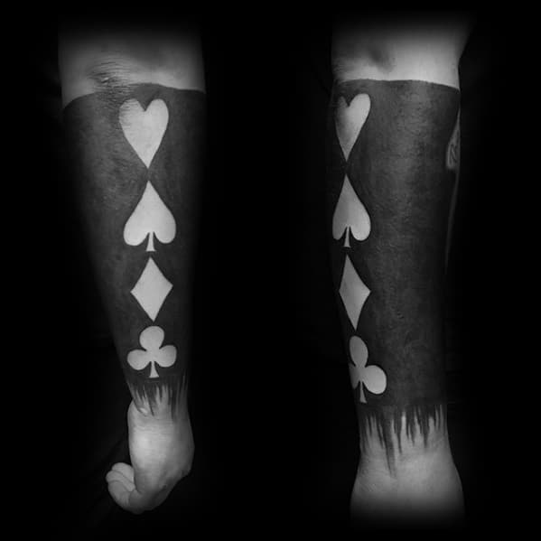 Blackout Sleeve Tattoo Playing Card Symbols Negative Space Design On Man