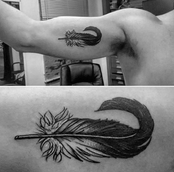 Blackwork Shaded Black And White Feather Tattoo On Mans Inner Bicep