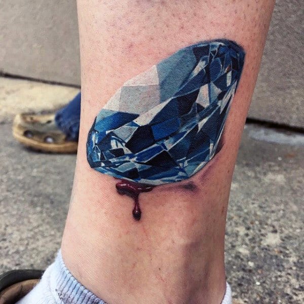 Blue 3d Diamond With Ripped Skin Tattoo On Mans Lower Leg