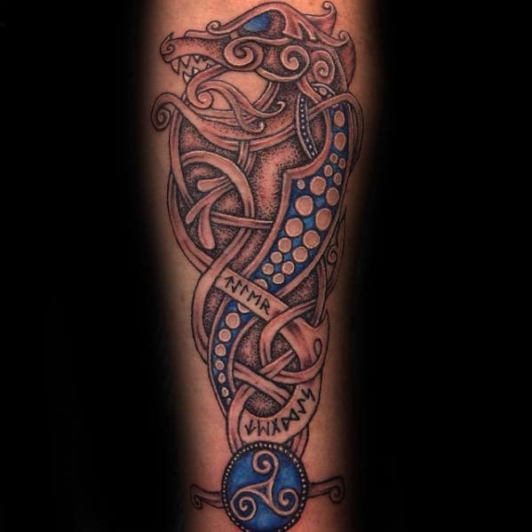 blue-and-grey-shaded-guys-celtic-dragon-inner-forearm-tattoo