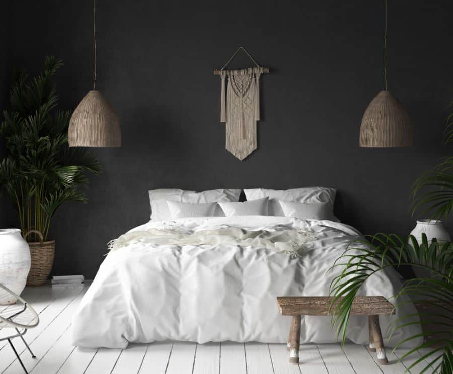 boho bedroom white floors black wall plants wood accent