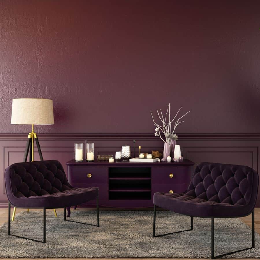 bold purple living room with cabinet and chairs