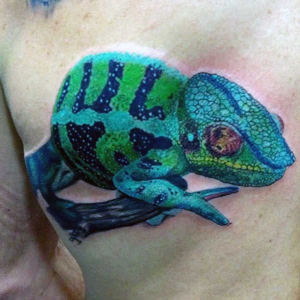 Bold Turquoise Lizard Tattoo On Chest For Men
