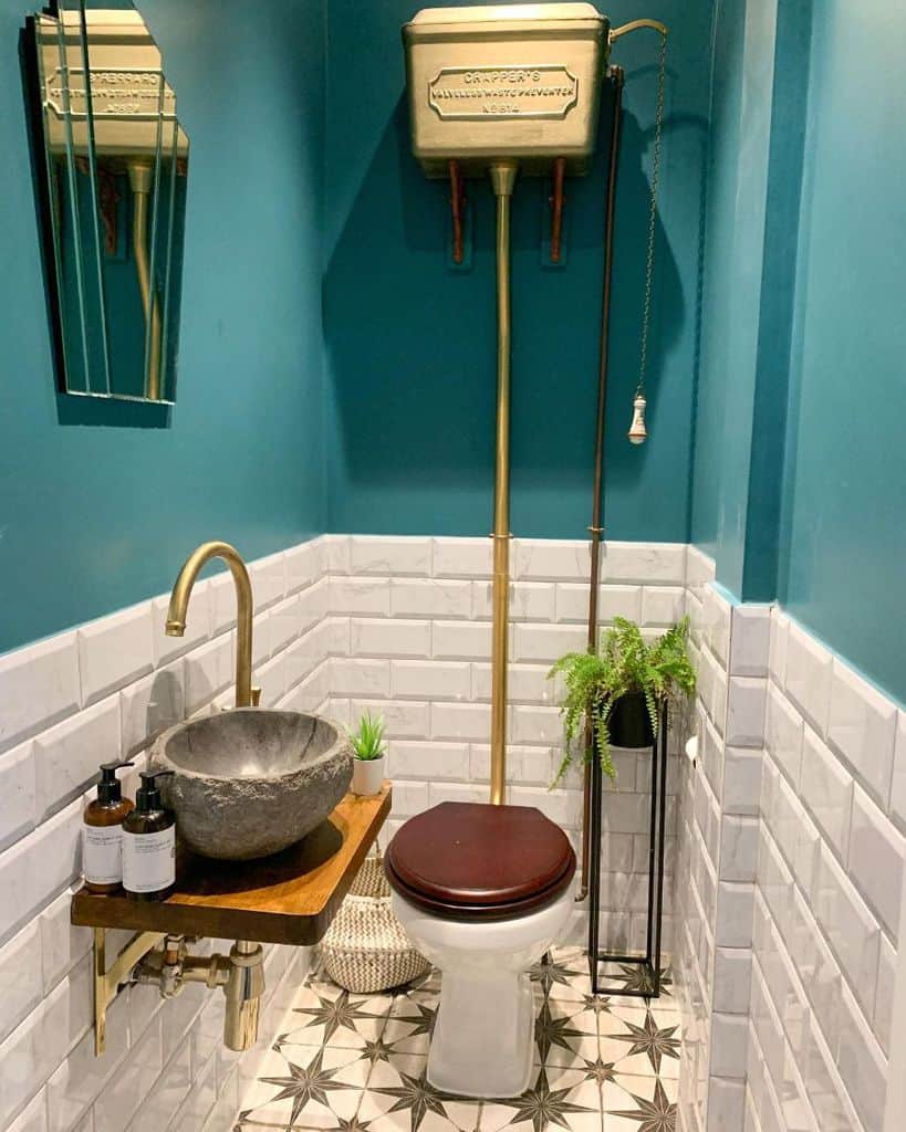 green wall and white tile vintage powder room