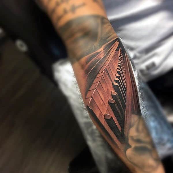 Brown And Black Piano Keys Tattoo For Males On Arms