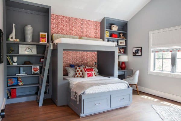 bed with seating above built-in shelves 