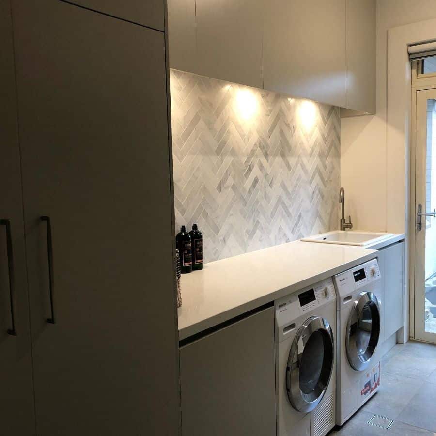 gray cabinet laundry room washer and dryer