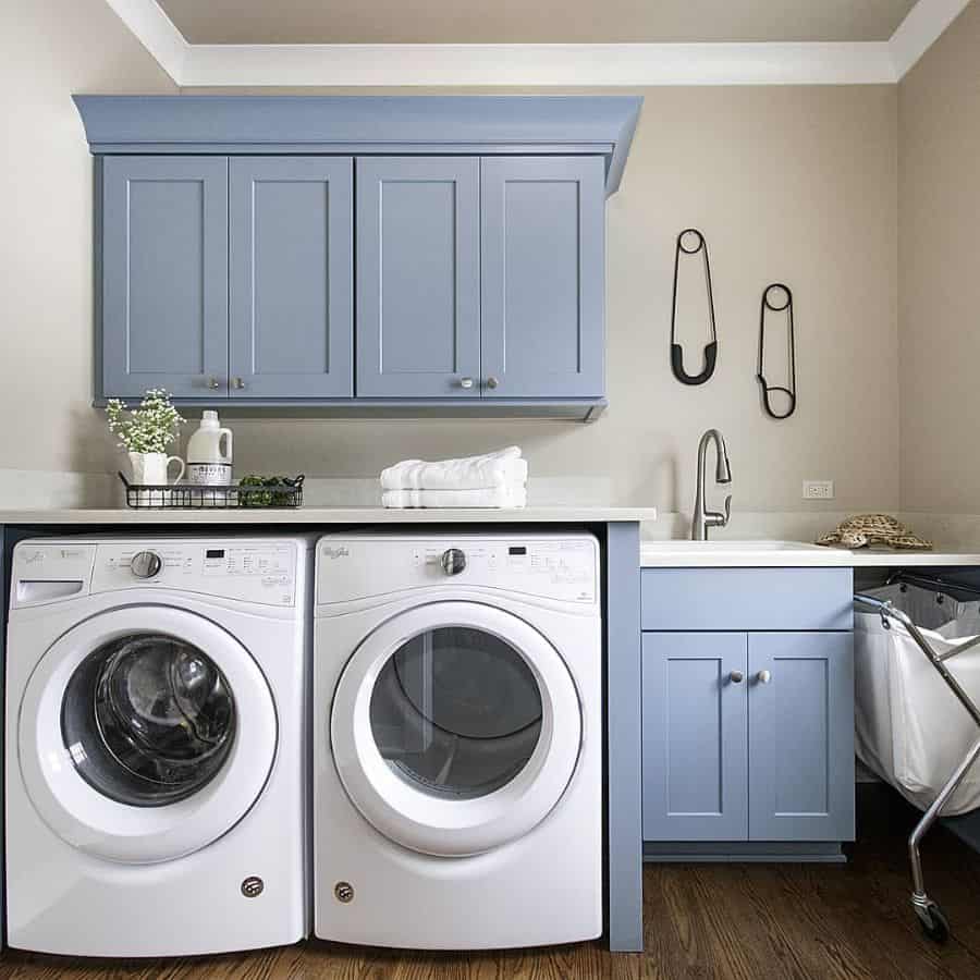 blue cabinet laundry room washer and dryer