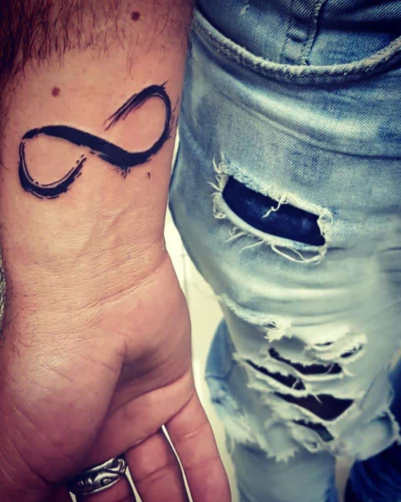 Calligraphy Style Black Ink Infinity Tattoo