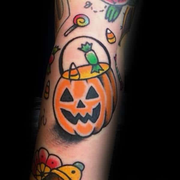 Candies And Orange Halloween Pumpkin Container Tattoo Male Forearm