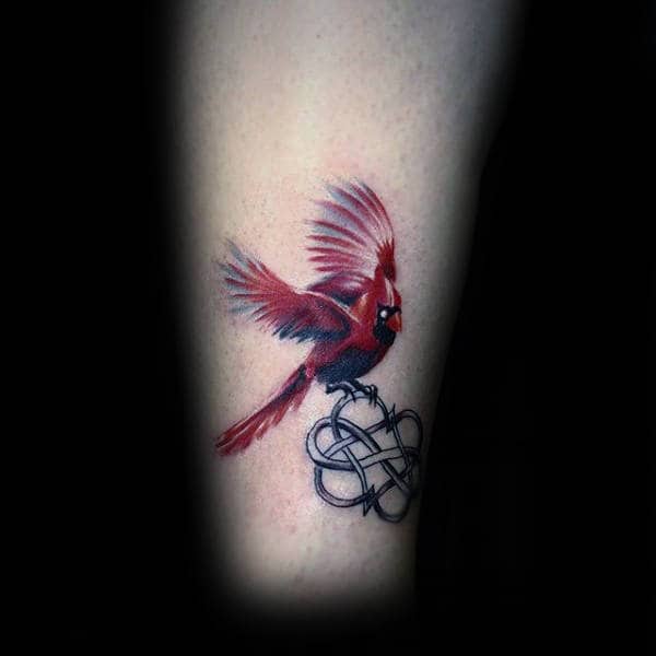 Minimalist cardinal tattoo on the wrist