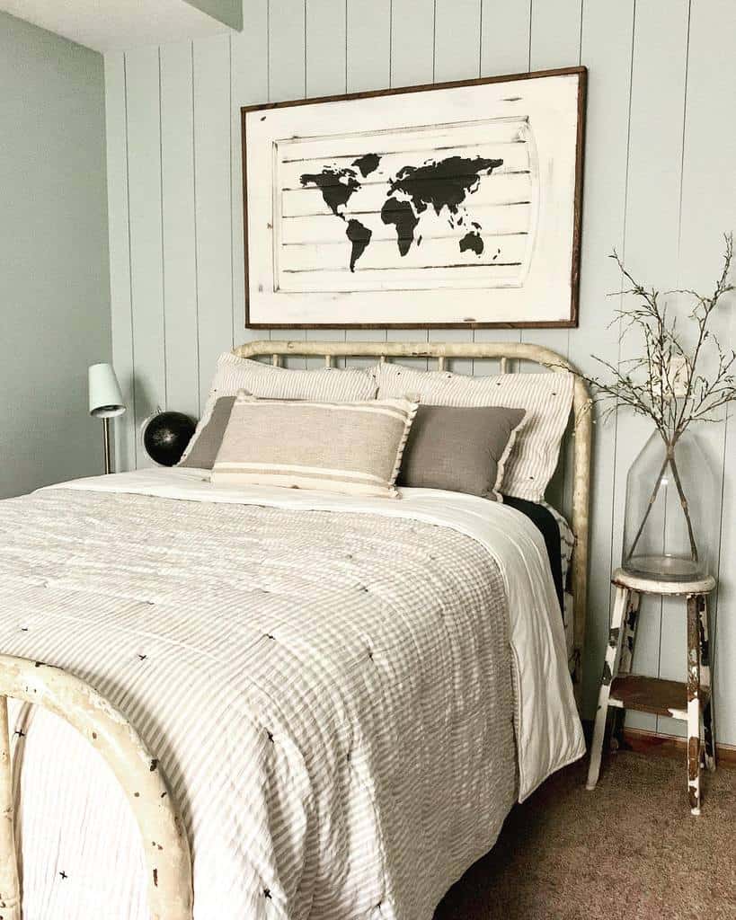 rustic bedroom with map of the world wall art