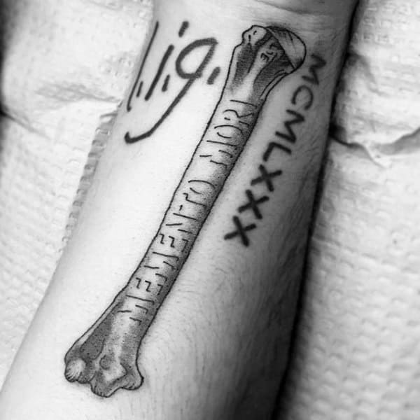 Carved Bone With Memento Mori Words Mens Arm Tattoo