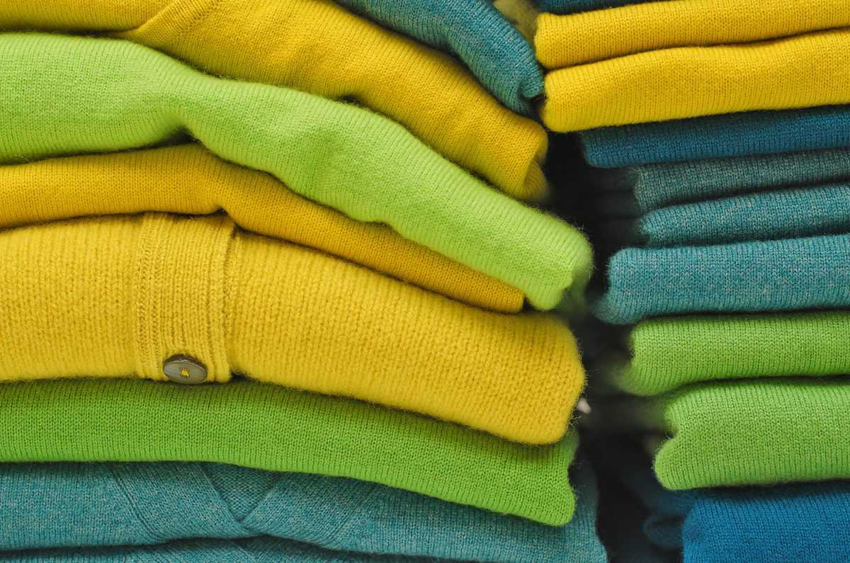 Stack,Of,Women’s,Sweaters,And,Cardigans,In,Bright,Vivid,Colours