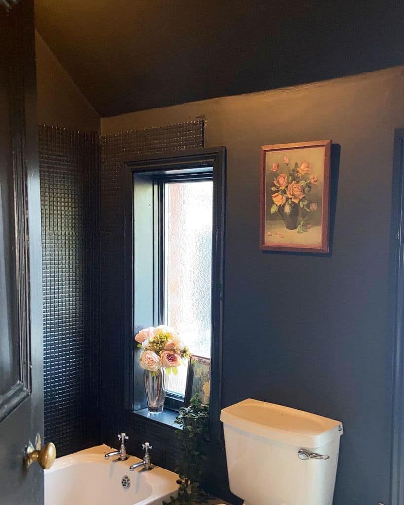 black painted bathroom with tub and toilet 