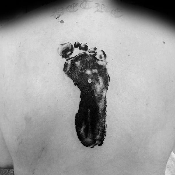 Center Of Back Footprint Tattoo On Male