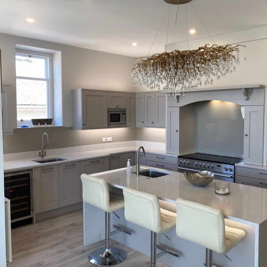 large wood chandelier in modern gray kitchen 