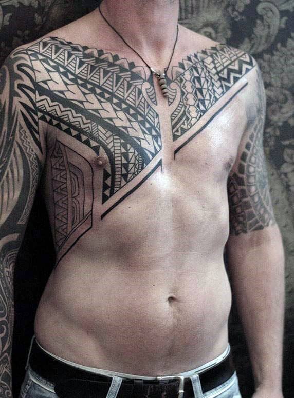 Chest To Arm Tribal Tattoos On Guy