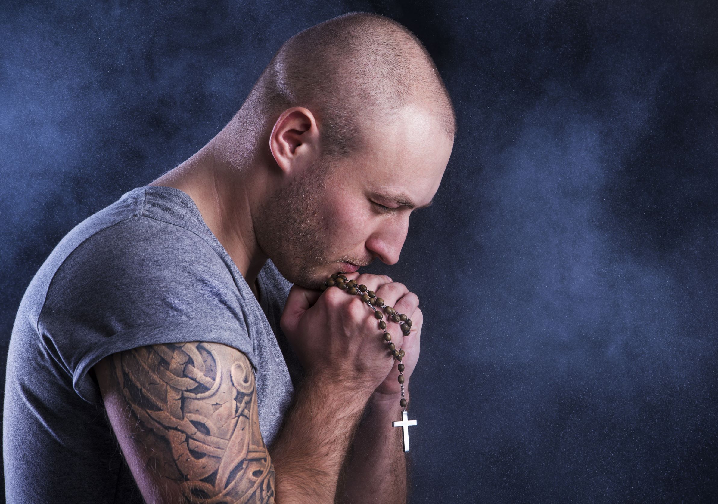 Christian Man Tattooed With Rosary Praying Hands