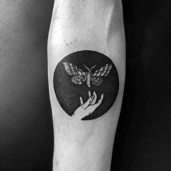 Circle Negative Space Hand With Moth Mens Inner Forearm Tattoos