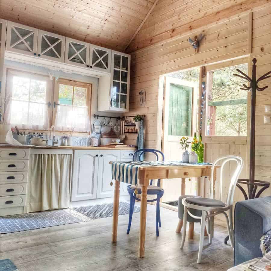 classic farmhouse kitchen ideas shiplap wall floorboards wood dining table and chairs 