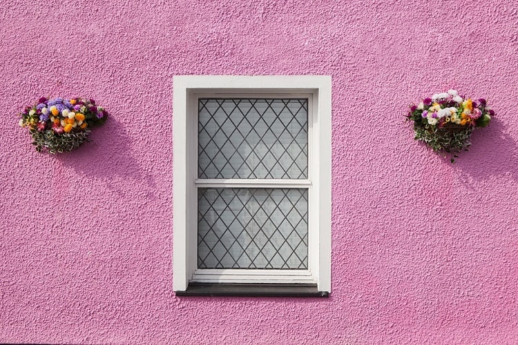 Classic White Stucco Exterior Window Trim In Pink Wall