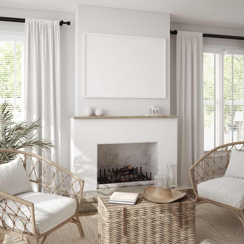 relaxed farmhouse living room white fireplace wicker furniture 