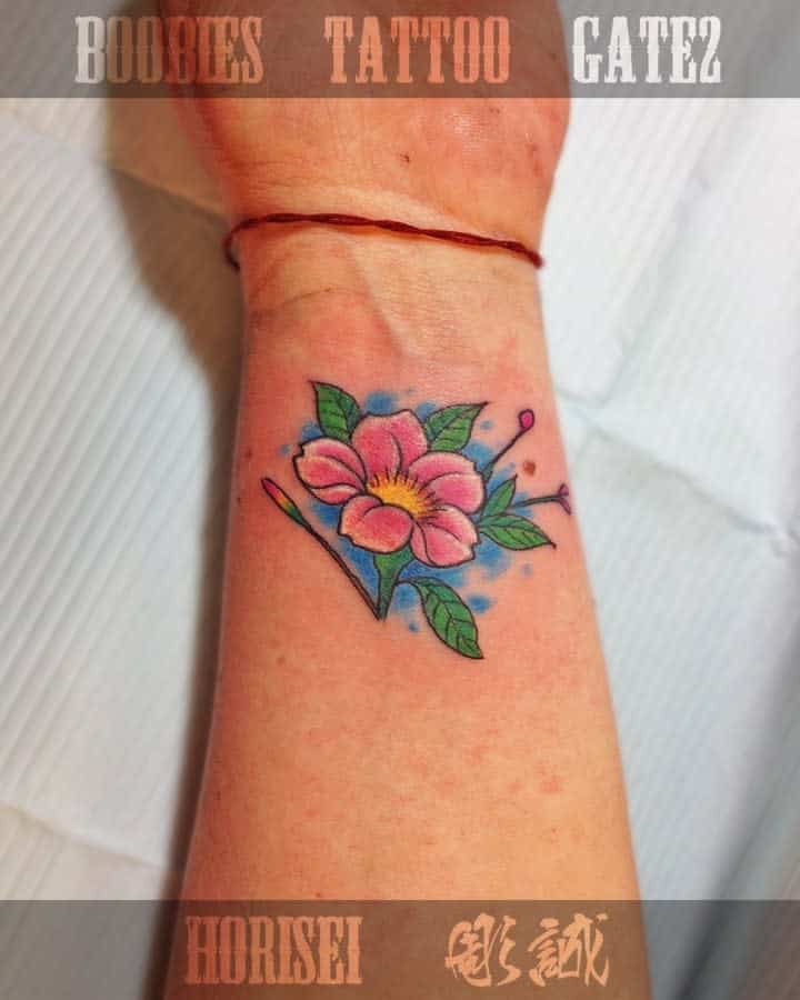 colorful flower wrist tattoo boobiestattoogate2st